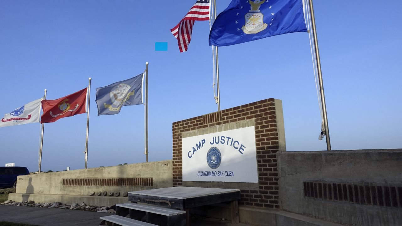 This photo screened by US Military officials on September 7, 2021 shows a sign for Camp Justice in Guantanamo Bay Naval Base, Cuba. The trial of five men accused of participating in the September 11, 2001 Al-Qaeda plot to attack the United States has moved extremely slowly before the military commissions in Guantanamo Bay, Cuba since the original charges were announced in February 2008. The case was withdrawn, and then refiled, and the first hearing took place May on 5, 2012.
Since then, dozens of hearings have taken place, all in the pre-trial phase. After a 17-month halt for the Covid-19 pandemic, the case is restarting Tuesday with a new judge, the eighth to preside. (Photo by Paul HANDLEY / AFP) (Photo by PAUL HANDLEY/AFP via Getty Images)