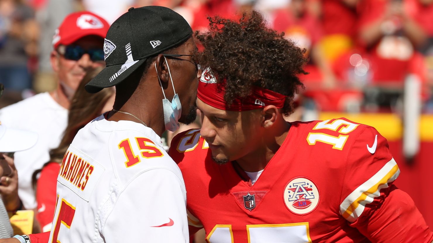Kansas City Chiefs quarterback Patrick Mahomes hugs his dad before a game against the Los Angeles Chargers on September 26, 2021.