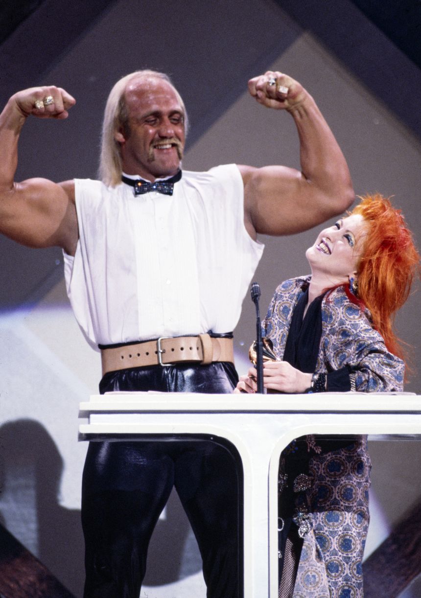 Hogan appears on stage with Cyndi Lauper at the Grammy Awards in 1985.