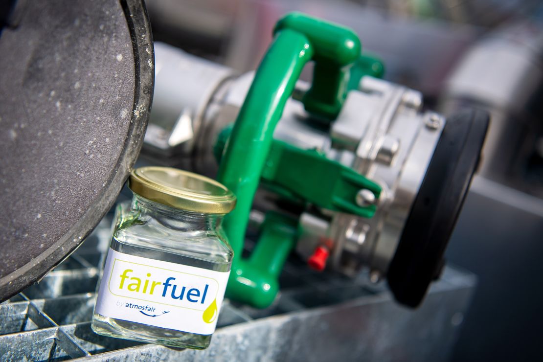 Small-scale e-fuel demo plants are already running — like Atmosfair in Germany. The organization says it is the first plant in the world capable of producing aircraft fuel synthetically on an industrial scale.