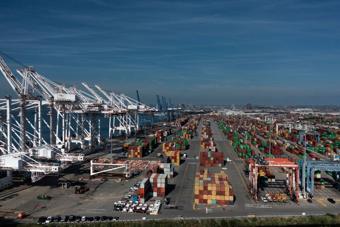 Cargo containers are readied for transport at the Port of Baltimore in Baltimore, Maryland, in an October 2021 file photo.