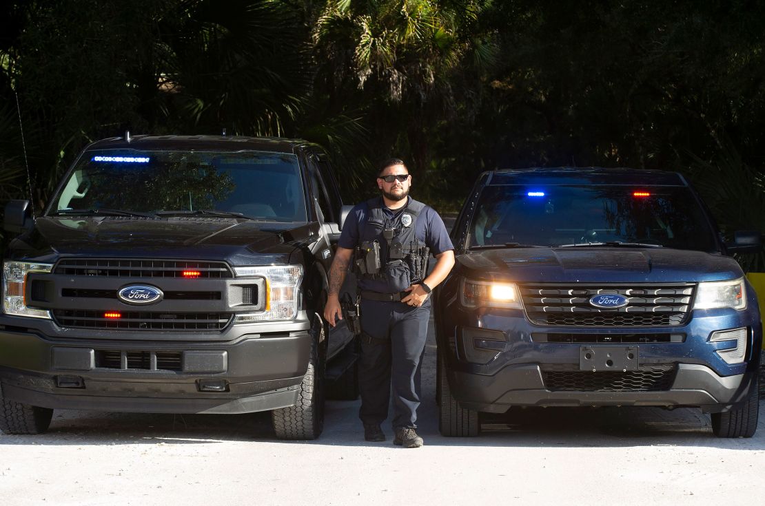 Officers with the North Port Police Department secure the entrance to Myakkahatchee Creek Environmental Park on October 20, 2021, in North Port, Florida. Human remains and personal items belonging to Brian Laundrie had been found there, officials said.