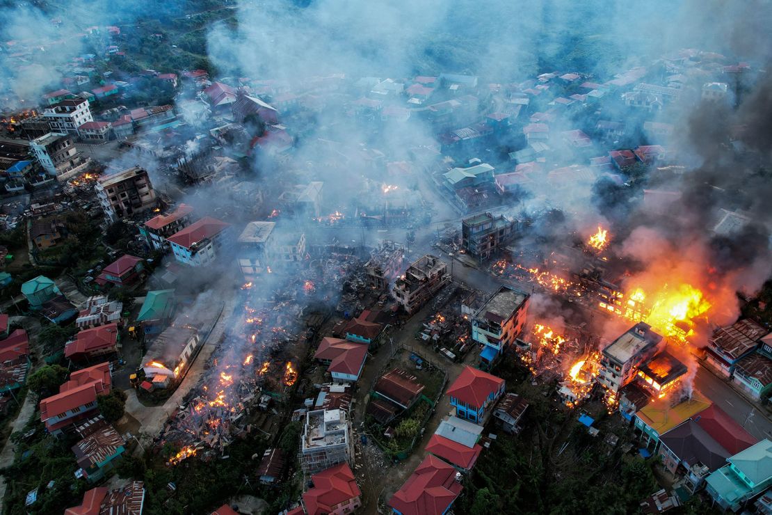 This aerial photo taken on October 29, 2021 show smokes and fires from Thantlang, in Chin State, where buildings were destroyed by shelling from junta troops, according to local media.