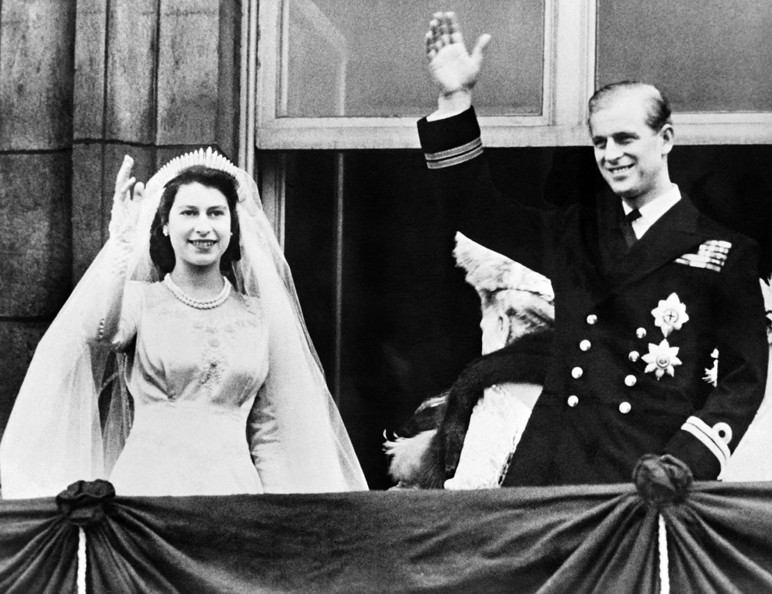 Queen Elizabeth II and Prince Philip, Duke of Edinburgh wave at their wedding on November 20, 1947.