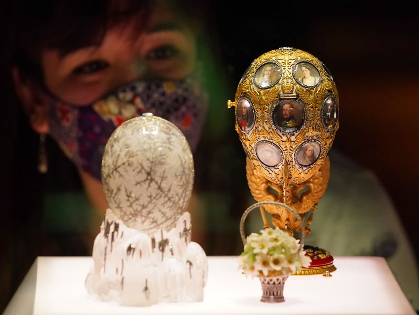 The Winter Egg (left) and the Romanov Tercentenary Egg (right) displayed at a 2021 exhibition at London's Victoria and Albert Museum.