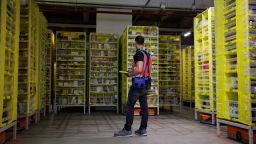 A maintenance employee works in a robotic warehouse at the Amazon's centre of Bretigny-sur-Orge, on December 14, 2021.