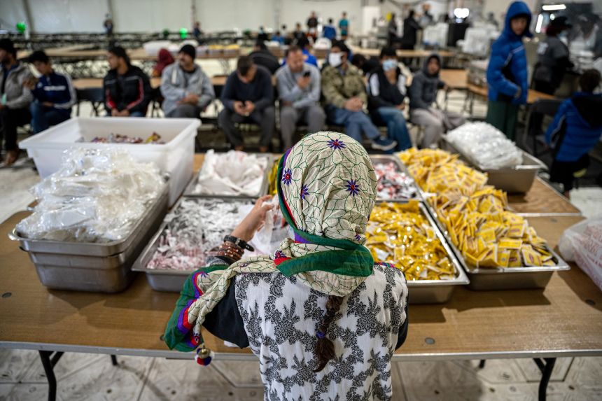 An Afghan child gets lunch in the dining hall at Fort Pickett in Virginia in 2021.