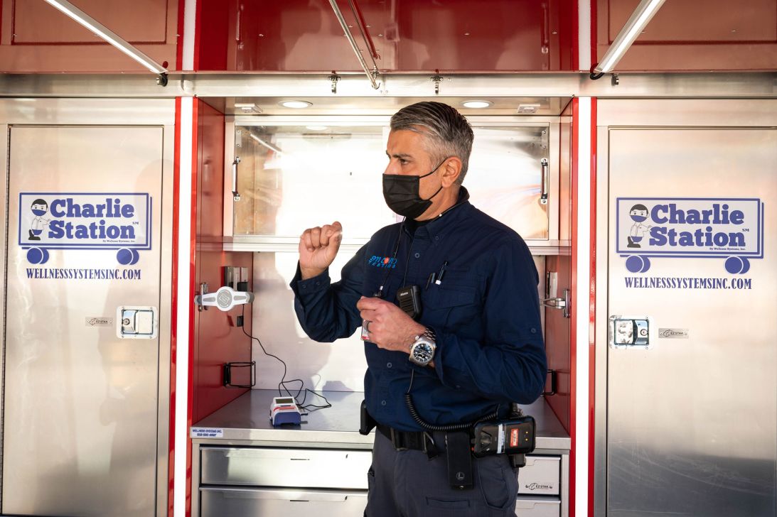 Steve Farzam, chief operating officer of 911 Covid Testing, talks about testing for flu and coronavirus in January 2022 near the Getty Center in Los Angeles.
