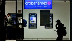 People withdraw money from a Citibanamex ATM in Mexico City, on January 11, 2022. - Citi announced on Tuesday it will exit its Mexican consumer banking business, the latest reorganization effort to steer the US financial heavyweight towards higher-return ventures. (Photo by Pedro PARDO / AFP) (Photo by PEDRO PARDO/AFP via Getty Images)