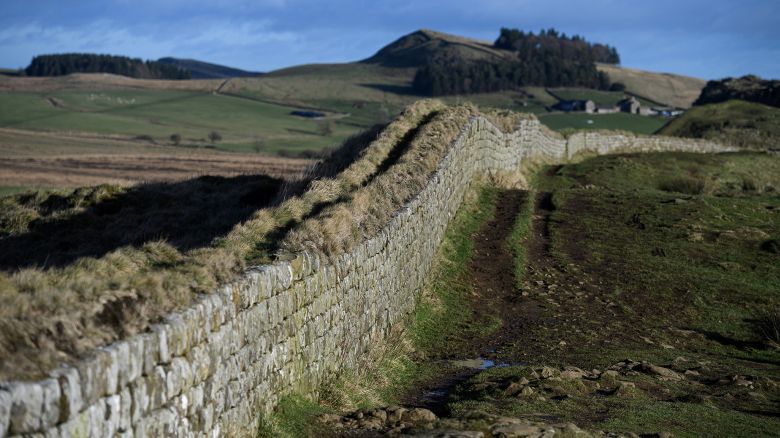 TOPSHOT - A picture shows a section of Hadrian's Wall near the wall's milecastle 39 near Hexham, northern England, on January 19, 2022. This year marks the 1900 anniversary of the start of the construction of Hadrian's Wall, which took 6 years to complete and was built to guard the northern frontier of the Roman Empire in 122 AD. The wall ran for 73 miles from the Solway Firth to Wallsend on the River Tyne and is now designated a UNESCO World Heritage Site. The wall featured over 80 milecastles or forts, two observation towers and 17 larger forts. After the Romans left Britain in the early 5th century, some 300 years after the wall was constructed, large sections of the wall fell into decay and were recycled into local buildings and houses. (Photo by OLI SCARFF / AFP) (Photo by OLI SCARFF/AFP via Getty Images)