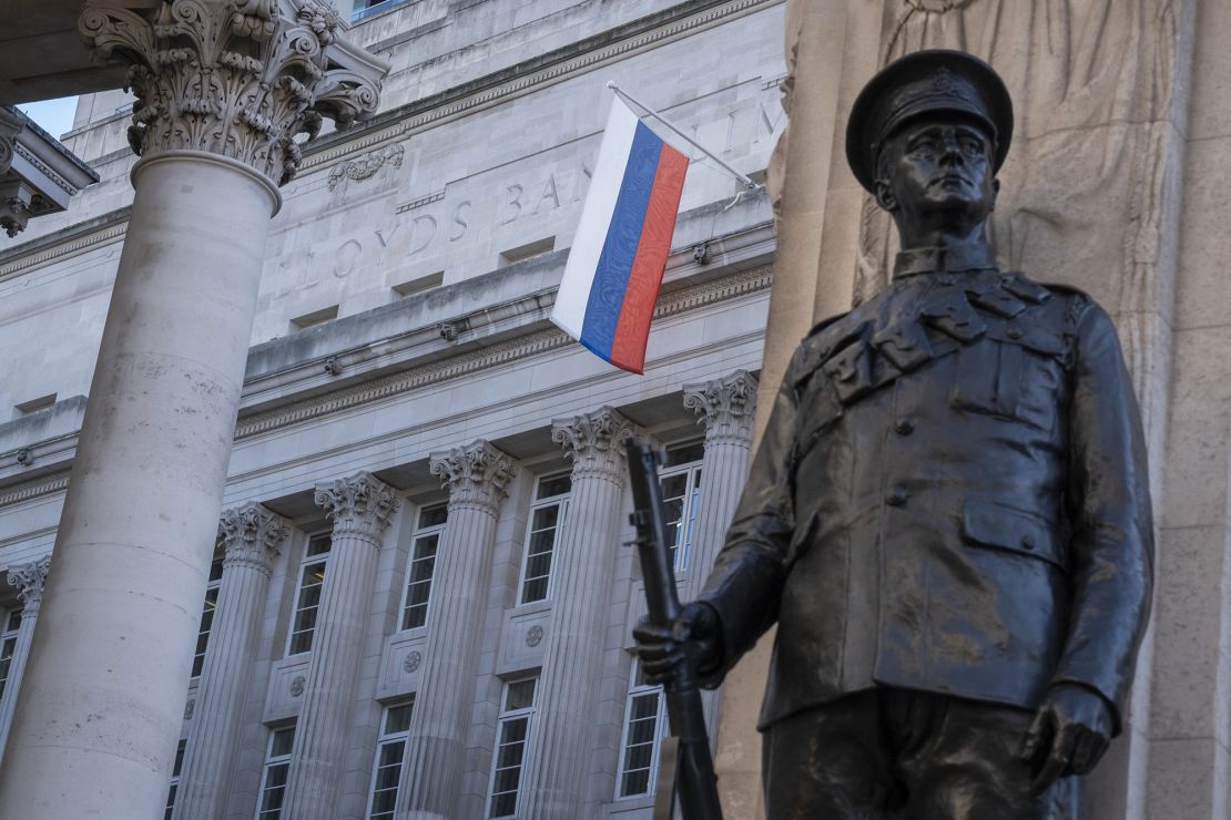 The Russian flag hangs from Russian investment Bank VTB Capital in London, above a memorial to World War I British war dead, on January 31, 2022, less than a month before Russia's full-scale invasion.