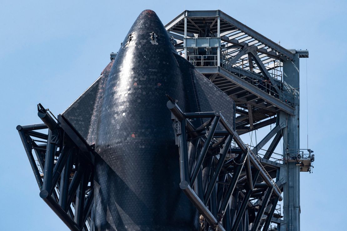 SpaceX's first orbital Starship SN20 is shown here stacked atop its massive Super Heavy Booster 4 at the company's Starbase facility near Boca Chica Village in South Texas on February 10, 2022.