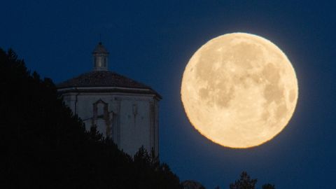 Full moon also known as "Snow Moon" sets behind Santa Maria della PietÃ  church in Rocca Calascio (AQ), Abruzzo, Italy, on February 16, 2022. (Photo by Lorenzo Di Cola/NurPhoto via Getty Images)