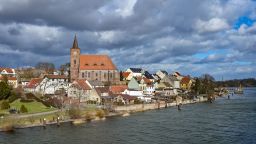 21 February 2022, Brandenburg, Eisenhüttenstadt: Clouds pass over the St. Nicholas Church of the Eisenhüttenstadt district of Fürstenberg. The district is located directly on the Oder-Spree Canal near the German-Polish border river Oder.