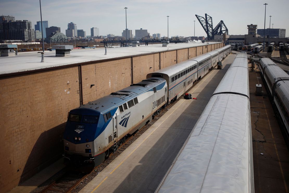 An Amtrak railroad passenger train pulls into the coach yard at Chicago Union Station in Chicago, Illinois, on March 2, 2022.