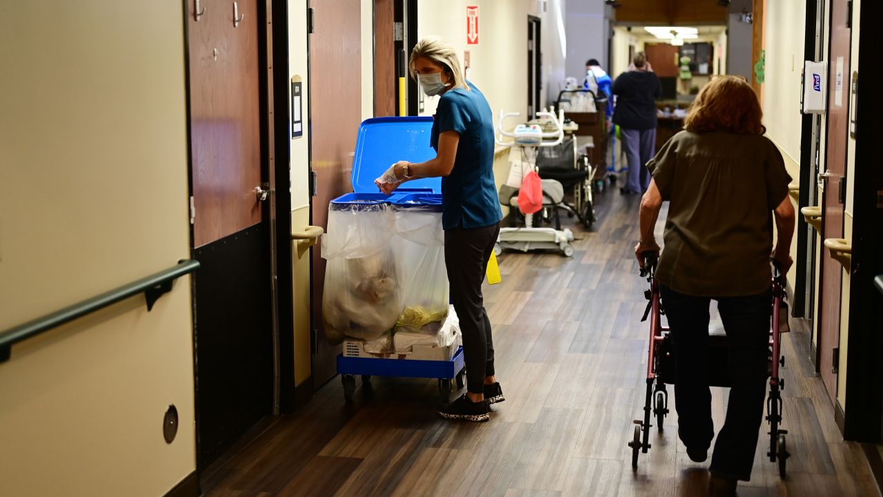 Staff Christy Tye, left, is house keeping at Good Samaritan Society nursing home in Loveland, Colorado on Tuesday, March 8, 2022.