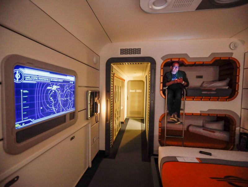 A room inside the hotel, featuring futuristic bunk beds.