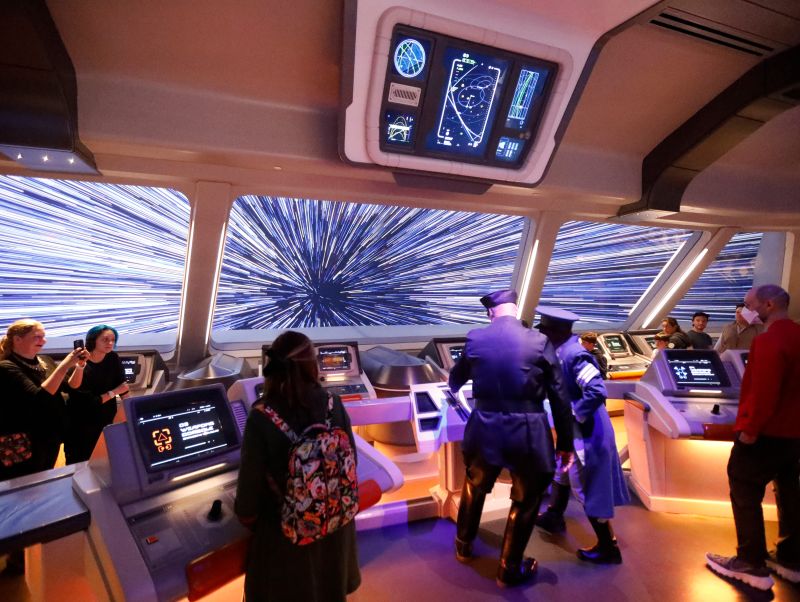 Guests enjoy one of the hotel's interactive scenes, featuring Disney cast members.