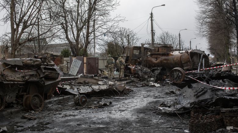 Ukrainian servicemen inspect the wreckage of Russian military vehicles in the town of Bucha, on the outskirts of Kyiv, after the Ukrainian army secured the area following the withdrawal of the Russian army from the Kyiv region on previous days, Bucha, Ukraine, April 8th, 2022.