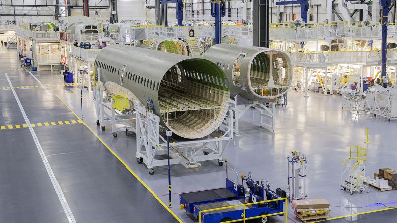 The fuselage of an Airbus A220 at the Airbus Canada LP pre-assembly plant in Mirabel, Quebec, Canada, on Thursday, April 14, 2022. Airbus has added 125,000 square feet of additional space in Mirabel, designed to support the A220 production ramp up capacity, which is expected to more than double in the next few years. Photographer: Graham Hughes/Bloomberg via Getty Images.