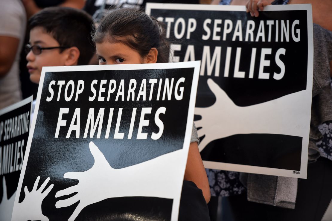 A girl holds a sign during a vigil held by the CHIRLA in downtown Los Angeles to denounce the Supreme Court's deadlocked decision on the DAPA/DACA immigration relief programs on June 23, 2016.