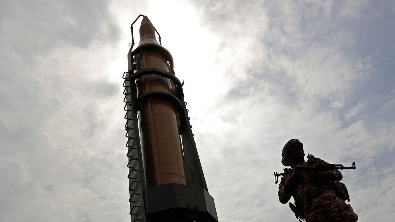 An Iranian soldier stands next to an Iranian Shahab-3 missile in Tehran, Iran on April 29, 2022.