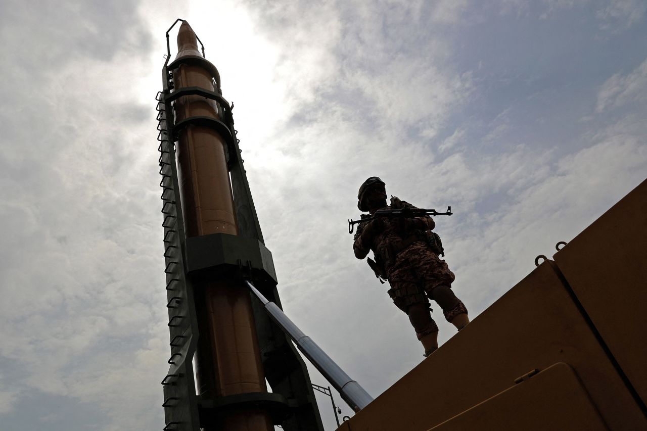 An Iranian soldier stands next to an Iranian Shahab-3 missile in Tehran, Iran on April 29, 2022.