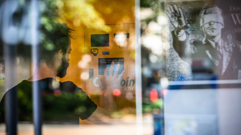 A customer uses a cryptocurrency automated teller machine (ATM) inside a BitBase cryptocurrency exchange in Barcelona, Spain, on Monday, May 16, 2022. The wipeout of algorithmic stablecoin TerraUSD and its sister token Luna knocked more than $270 billion off the crypto sectors total trillion-dollar value in the most volatile week for Bitcoin trading in at least two years. Photographer: Angel Garcia/Bloomberg via Getty Images
