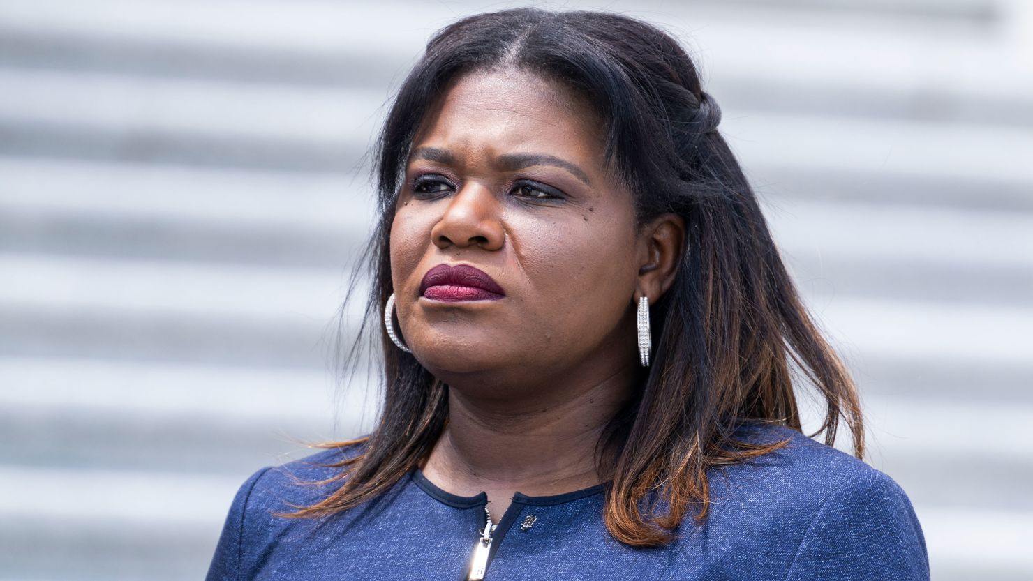 Rep. Cori Bush attends an event with the Congressional Tri-Caucus to condemn the the racist mass shooting in Buffalo, on the House steps of the US Capitol on May 19, 2022.