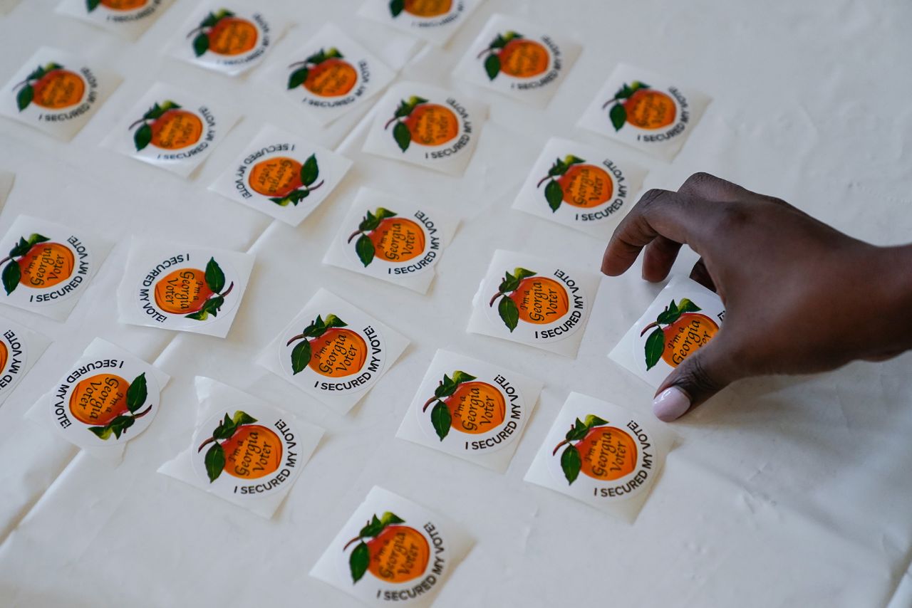 A voter picks up an "I Secured My Vote" sticker after casting a ballot at a polling location in Atlanta in May 2022.