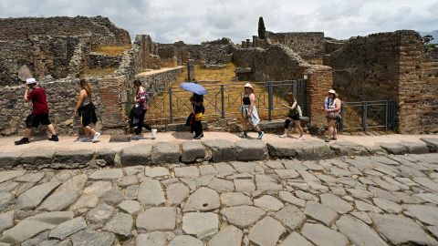 Visitors tour the Archaeological Park of Pompeii, near Naples, southern Italy, on June 9, 2022. (Photo by Andreas SOLARO / AFP) (Photo by ANDREAS SOLARO/AFP via Getty Images)