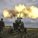 TOPSHOT - Ukrainian servicemen fire with a French self-propelled 155 mm/52-calibre gun Caesar towards Russian positions at a front line in the eastern Ukrainian region of Donbas on June 15, 2022. - Ukraine pleaded with Western governments on June 15, 2022 to decide quickly on sending heavy weapons to shore up its faltering defences, as Russia said it would evacuate civilians from a frontline chemical plant. (Photo by ARIS MESSINIS / AFP) (Photo by ARIS MESSINIS/AFP via Getty Images)