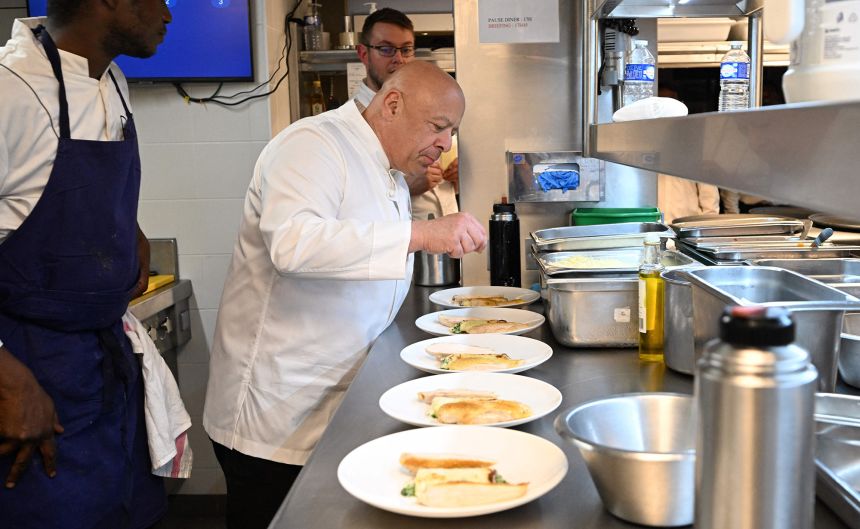 Thierry Marx cooks in the kitchen of Madame Brasserie, his restaurant on the first floor of the Eiffel Tower.