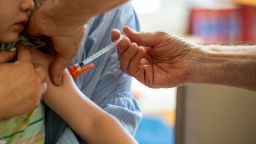 A young child receives a Moderna Covid-19 6 months to 5 years vaccination at Temple Beth Shalom in Needham, Massachusetts on June 21, 2022. The temple was one of the first sites in the state to offer vaccinations to anyone in the public.. US health authorities on Saturday cleared the Pfizer and Moderna Covid-19 vaccines for children aged five and younger, in a move President Joe Biden greeted as a "monumental step" in the fight against the virus.
