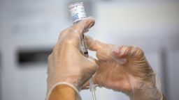 A healthcare worker prepares a dose of the Moderna Covid-19 at the Brooklyn Children's Museum vaccination site, serving children six months to 5-Years old, in the Brooklyn borough of New York, US, on Thursday, June 23, 2022. Covid-19 vaccines for?children?under 5 years old were authorized by the US Food and Drug Administration?on Friday?and by the Centers for Disease Control and Prevention on Saturday, a?welcome relief to parents of the last age group to become eligible for shots.