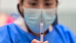 A health worker prepares a dose of the Pfizer-BioNTech vaccine against COVID-19 to be applied to children from 5 to 11 years old, in Mexico City, on June 27, 2022. (Photo by Pedro PARDO / AFP) (Photo by PEDRO PARDO/AFP via Getty Images)