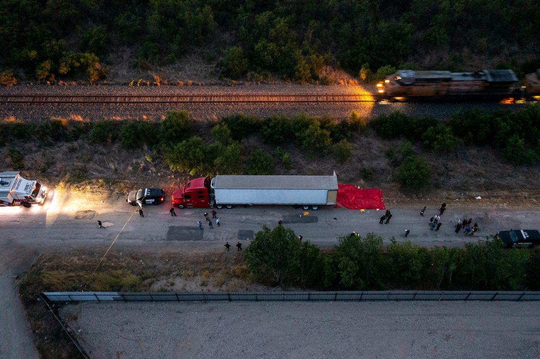  In this aerial view, members of law enforcement investigate a tractor trailer on June 27, 2022 in San Antonio, Texas.