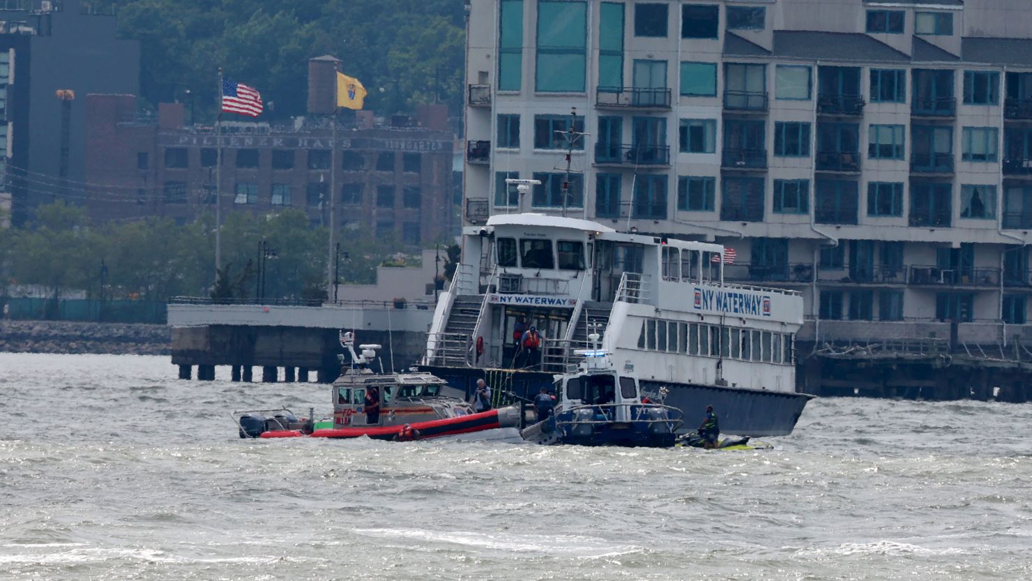 NYPD and FDNY scuba dive teams and a NY Waterway Ferry float near the boat accident on the Hudson River in 2022.