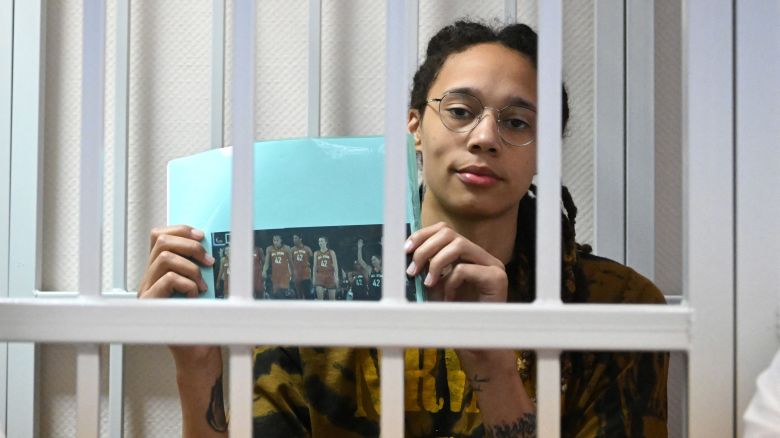 TOPSHOT - US WNBA basketball superstar Brittney Griner sits inside a defendants' cage during a hearing at the Khimki Court in the town of Khimki outside Moscow on July 15, 2022. - Griner, a two-time Olympic gold medallist and WNBA champion, was detained at Moscow airport in February on charges of carrying in her luggage vape cartridges with cannabis oil, which could carry a 10-year prison sentence. (Photo by NATALIA KOLESNIKOVA / AFP) (Photo by NATALIA KOLESNIKOVA/AFP via Getty Images)