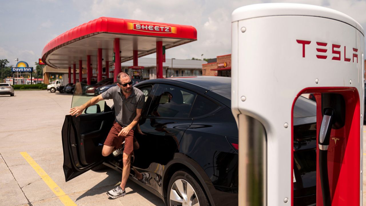 A driver stops to charge a Tesla vehicle at a Sheetz gas station in Breezewood, Pennsylvania, on Thursday, June 16, 2022.