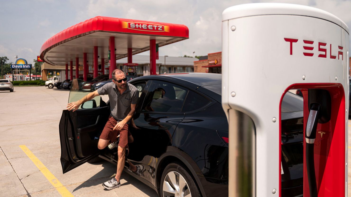 A driver stops to charge a Tesla vehicle at a Sheetz gas station in Breezewood, Pennsylvania, on Thursday, June 16, 2022.