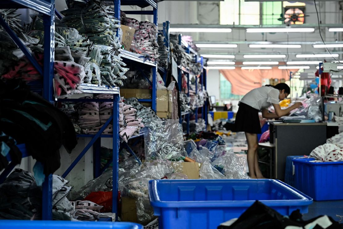 A worker makes clothes at a garment factory that supplies Shein in Guangzhou, China on July 18, 2022. Shein reportedly has a production rate of as little as three days from start to finish.