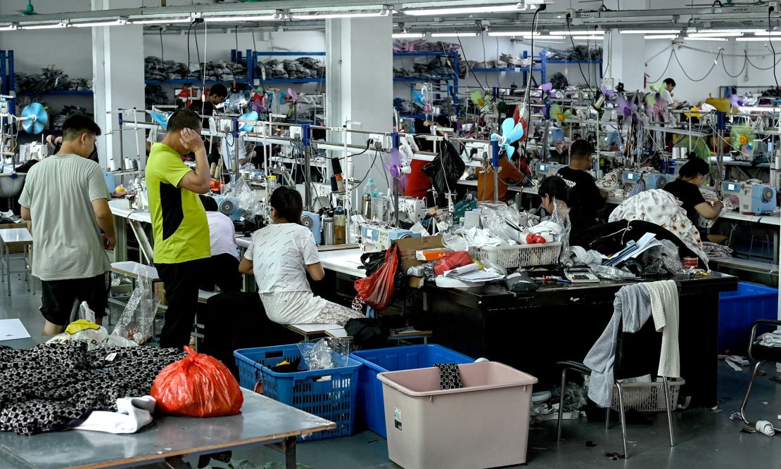 Workers make clothes at a garment factory that supplies Shein in China's southern Guangdong province in July 2022.
