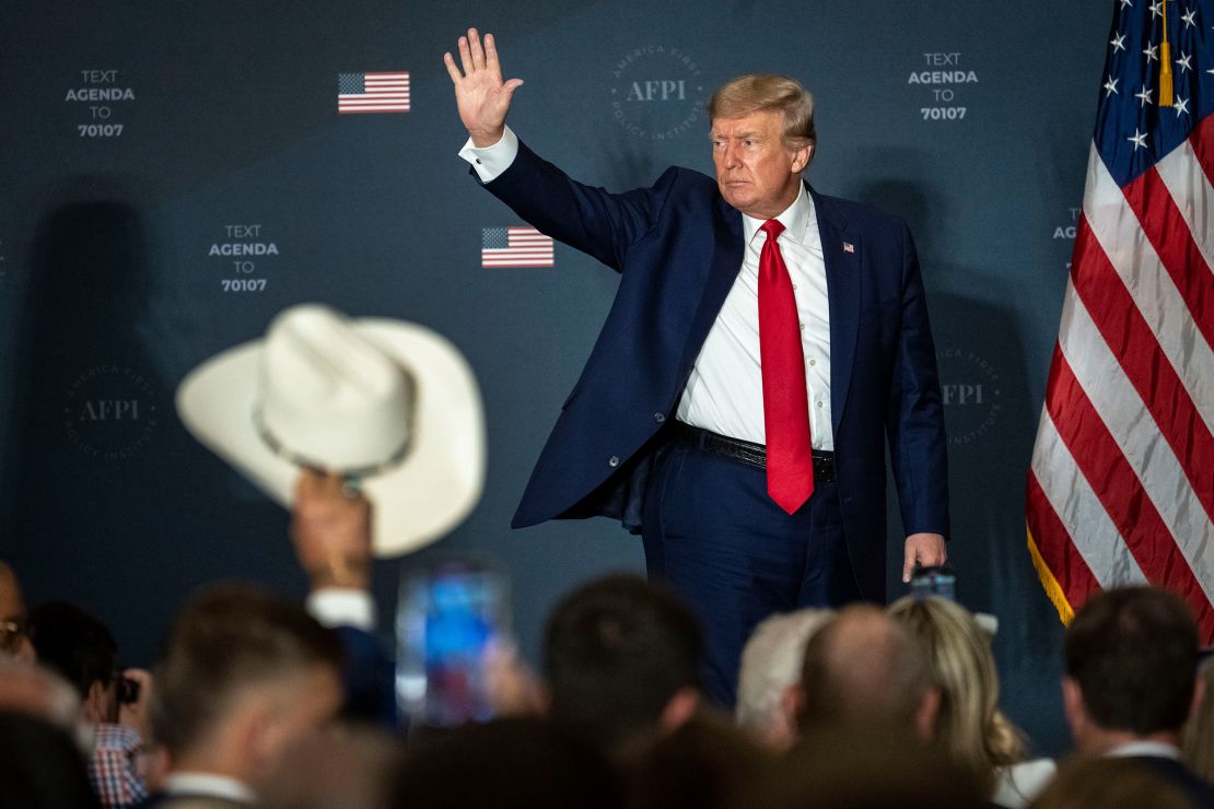 In this July 2022 photo, Trump waves to a crowd attending the America First Agenda Summit at the Marriott Marquis hotel in Washington, DC.