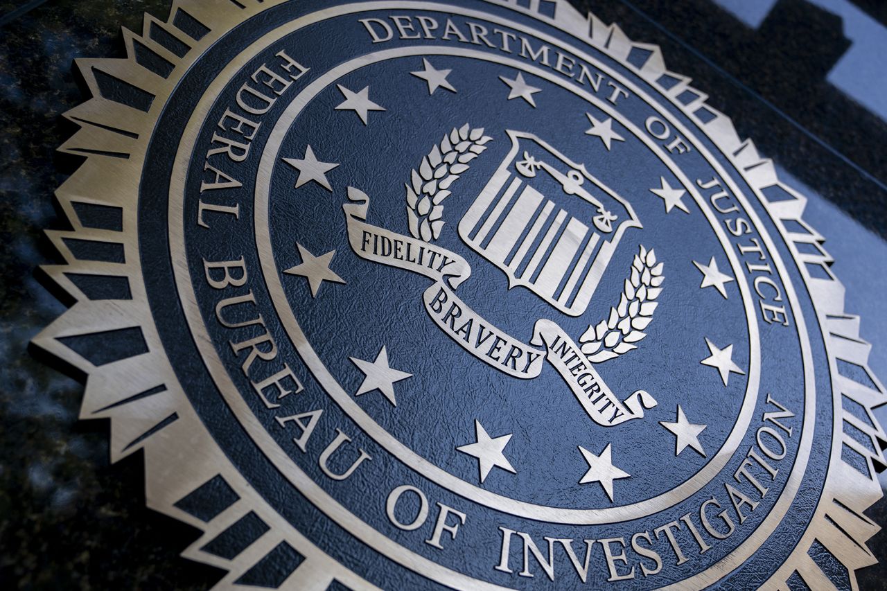 A seal reading "Department of Justice Federal Bureau of Investigation" is displayed on the J. Edgar Hoover FBI building in Washington, DC, on August 9, 2022.