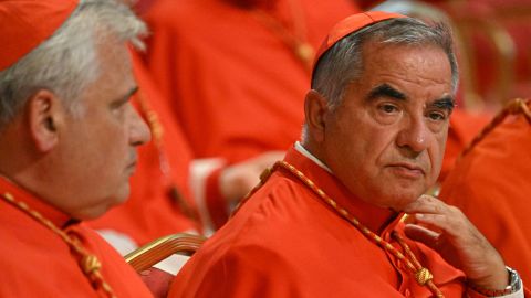 Italian Cardinal Giovanni Angelo Becciu (R) waits prior to the start of a consistory during which 20 new Cardinals are to be created by the Pope, on August 27, 2022 at St. Peter's Basilica in The Vatican. (Photo by Alberto PIZZOLI / AFP) (Photo by ALBERTO PIZZOLI/AFP via Getty Images)