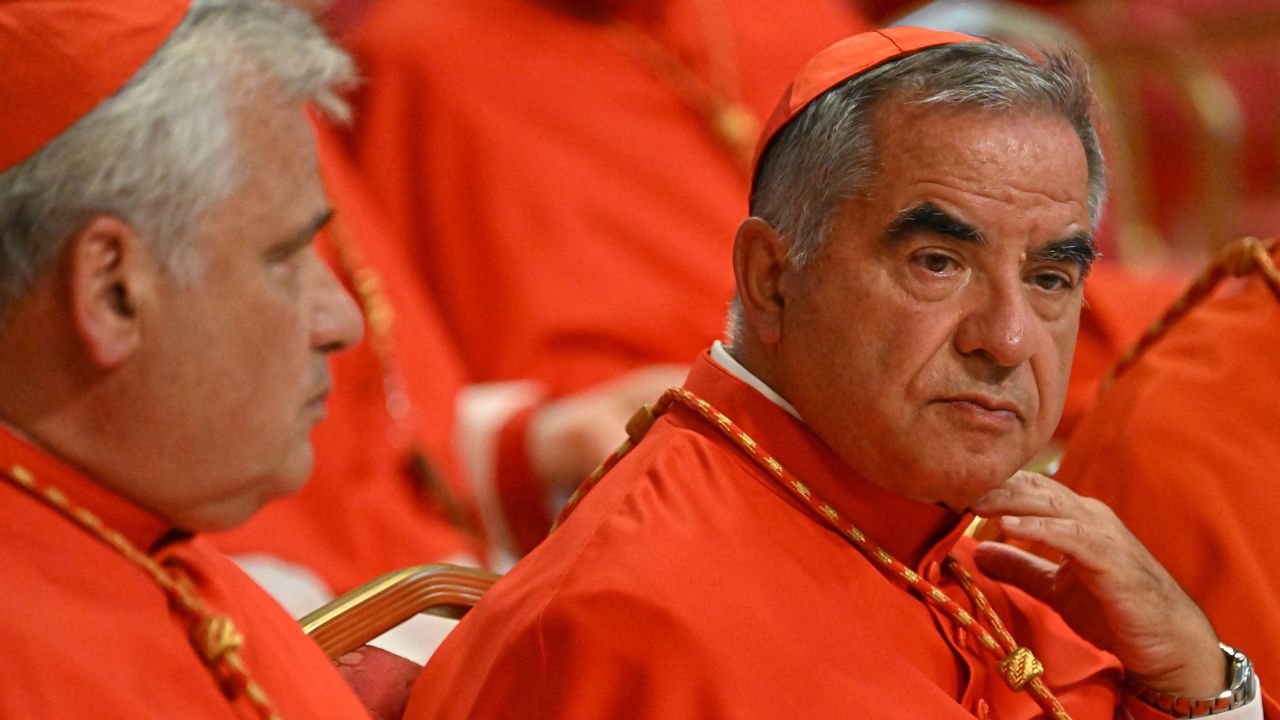 Italian Cardinal Giovanni Angelo Becciu (R) waits prior to the start of a consistory during which 20 new Cardinals are to be created by the Pope, on August 27, 2022 at St. Peter's Basilica in The Vatican. (Photo by Alberto PIZZOLI / AFP) (Photo by ALBERTO PIZZOLI/AFP via Getty Images)