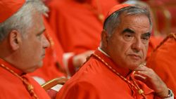 Italian Cardinal Giovanni Angelo Becciu (R) waits prior to the start of a consistory during which 20 new Cardinals are to be created by the Pope, on August 27, 2022 at St. Peter's Basilica in The Vatican. (Photo by Alberto PIZZOLI / AFP) (Photo by ALBERTO PIZZOLI/AFP via Getty Images)