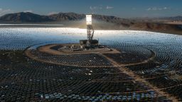 NIPTON, CA - AUGUST 26: In an aerial view, a boiler tower is surrounded by mirrors at the Ivanpah Solar Electric Generating System in the Mojave Desert on August 26, 2022 near Nipton, California. As drought, wildfires and monsoonal desert flash floods worsen in California, the development of solar energy farms has become prioritized as a means to lessen some of the worst impacts of human-caused climate change. Ironically, this "green energy" is harming the environment as it sprawls across pristine desert land, which stores carbon in the ground. California deserts account for nearly 10 percent of the states carbon sequestration. The Ivanpah Solar Electric Generating System is one of the biggest but has been challenged by reports that thousands of birds have been incinerated mid-flight by intense heat in the concentrated sun rays that are reflected to giant boiler towers. (Photo by David McNew/Getty Images)