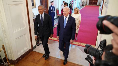 US President Joe Biden and First Lady Jill Biden along with former president Barack Obama and wife Michelle Obama arrive to take part in the unveiling of the Obamas official White House portraits in the East Room of the White House in Washington, DC on September 7, 2022.